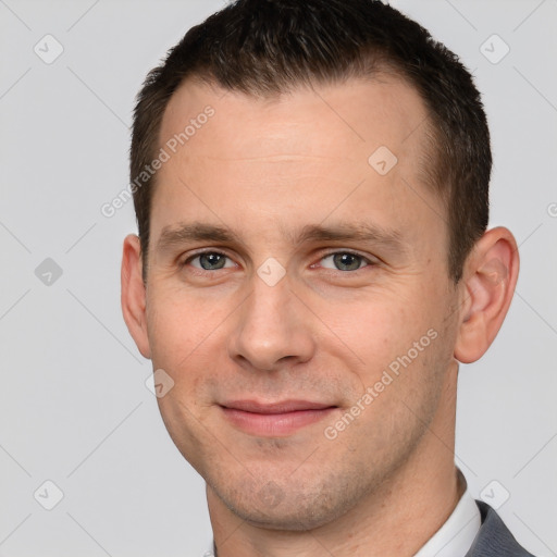 Joyful white young-adult male with short  brown hair and brown eyes