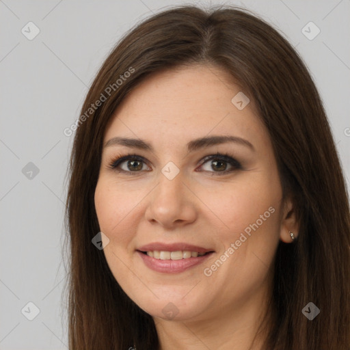 Joyful white young-adult female with long  brown hair and brown eyes