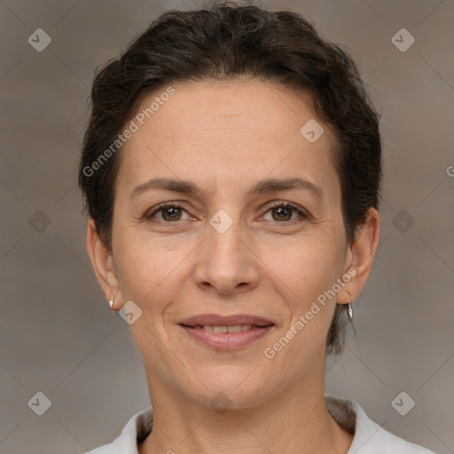 Joyful white adult female with short  brown hair and brown eyes