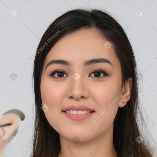 Joyful white young-adult female with long  brown hair and brown eyes