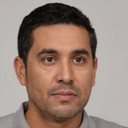 Neutral latino adult male with short  black hair and brown eyes