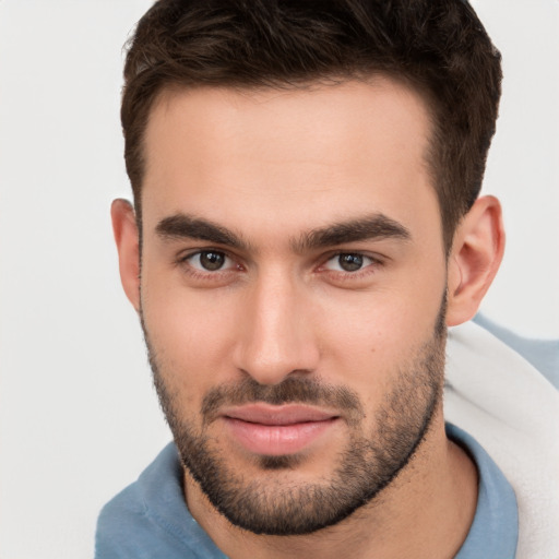 Joyful white young-adult male with short  brown hair and brown eyes