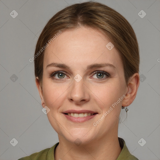 Joyful white young-adult female with medium  brown hair and grey eyes