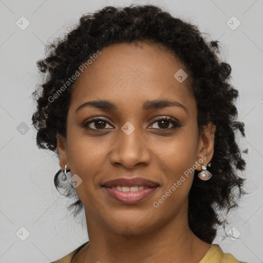 Joyful black young-adult female with long  brown hair and brown eyes