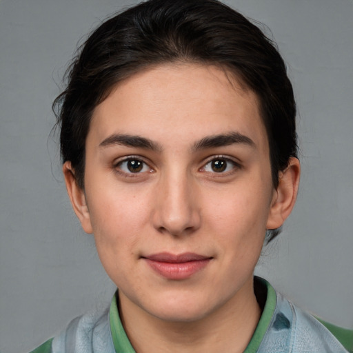 Joyful white young-adult female with medium  brown hair and brown eyes