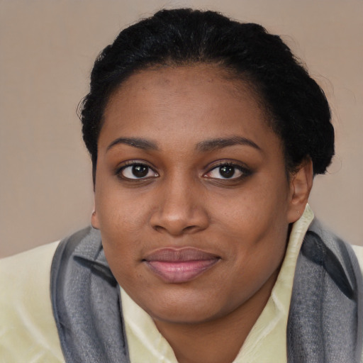 Joyful asian young-adult female with short  black hair and brown eyes