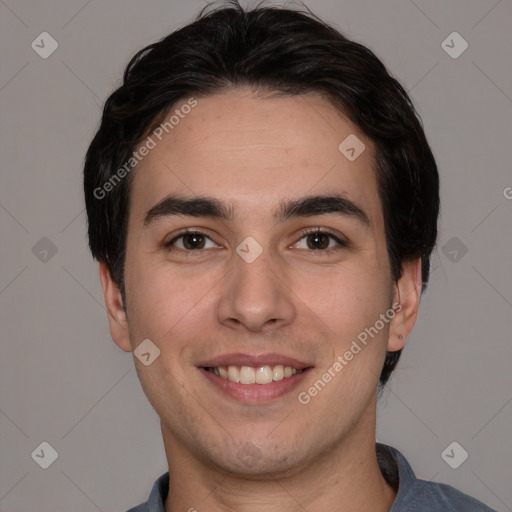 Joyful white young-adult male with short  black hair and brown eyes