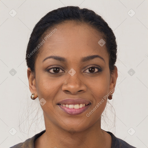 Joyful black young-adult female with short  black hair and brown eyes