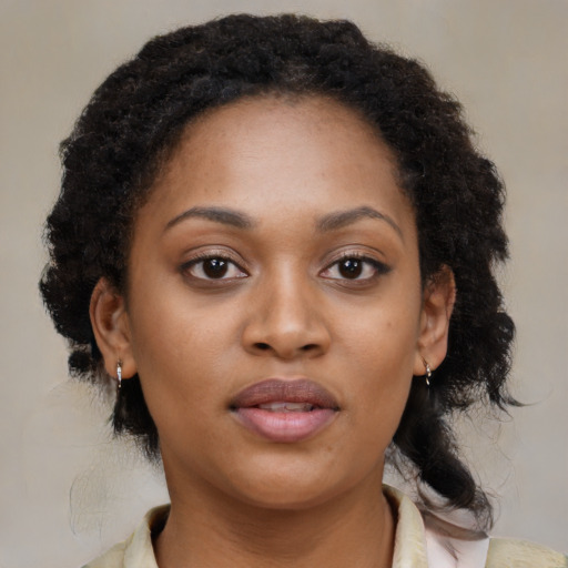 Neutral black young-adult female with medium  brown hair and brown eyes