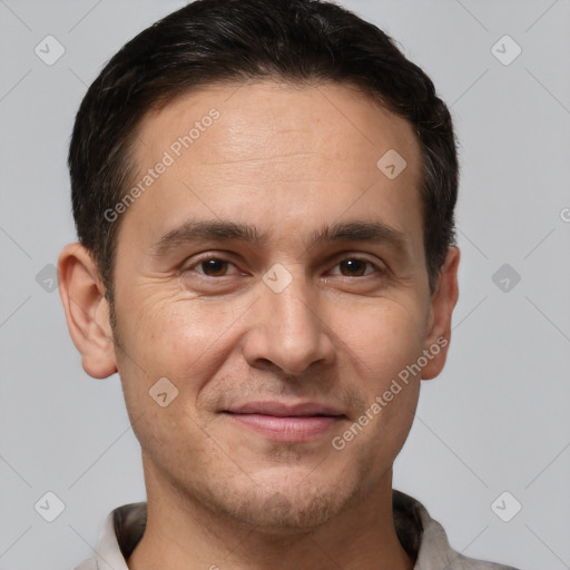 Joyful white adult male with short  brown hair and brown eyes