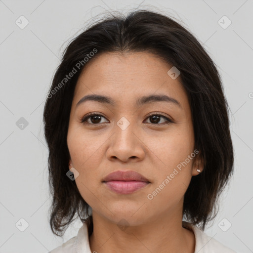 Joyful asian young-adult female with medium  brown hair and brown eyes