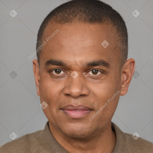 Joyful black adult male with short  brown hair and brown eyes