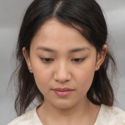 Neutral asian young-adult female with medium  brown hair and brown eyes