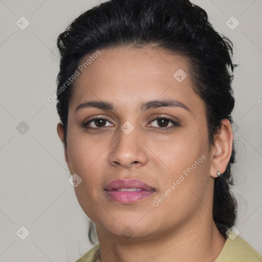 Joyful latino young-adult female with short  black hair and brown eyes