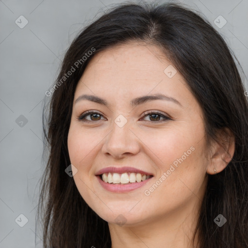 Joyful white young-adult female with long  brown hair and brown eyes