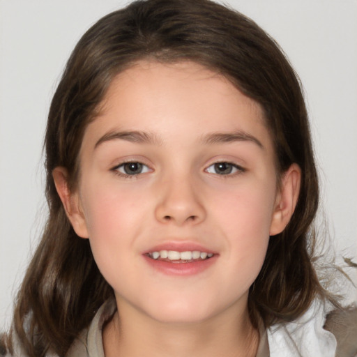 Joyful white child female with medium  brown hair and brown eyes