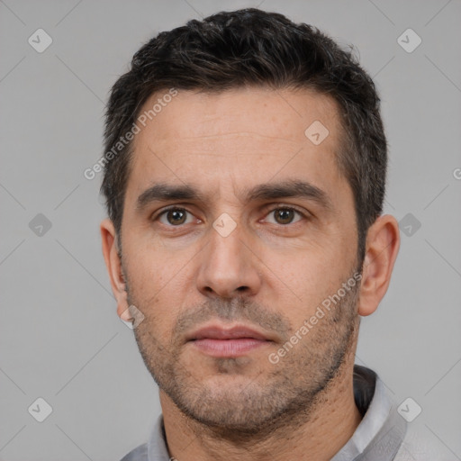 Neutral white adult male with short  black hair and brown eyes