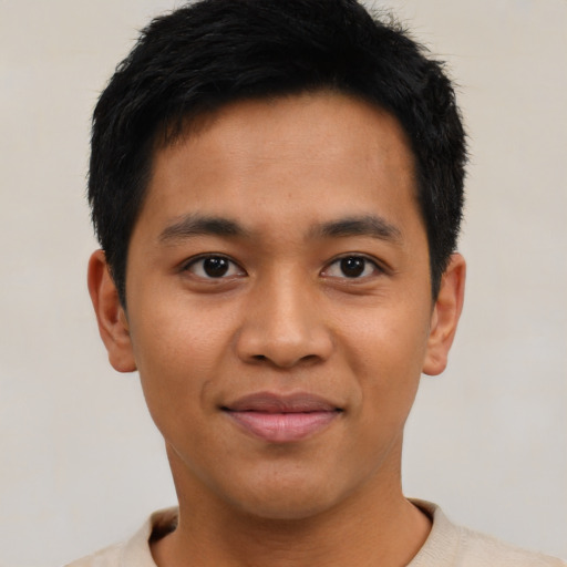 Joyful asian young-adult male with short  black hair and brown eyes