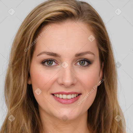 Joyful white young-adult female with long  brown hair and green eyes