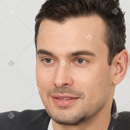 Joyful white young-adult male with short  brown hair and brown eyes