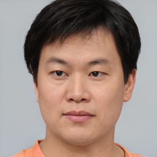 Neutral asian young-adult male with short  brown hair and brown eyes