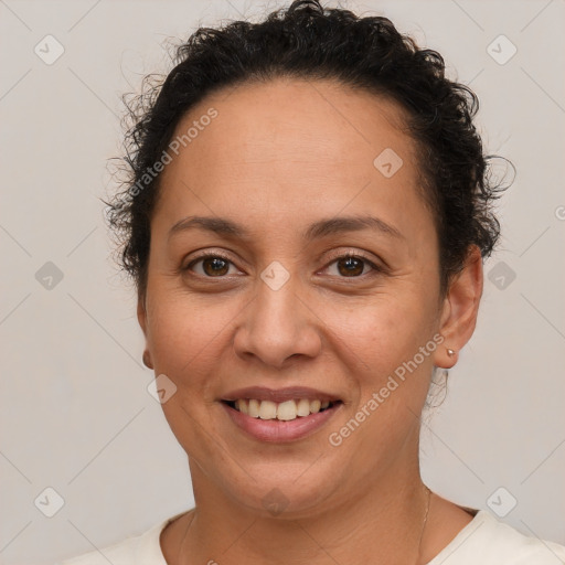 Joyful white adult female with short  brown hair and brown eyes