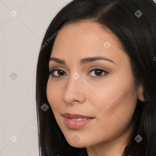 Joyful latino young-adult female with long  brown hair and brown eyes