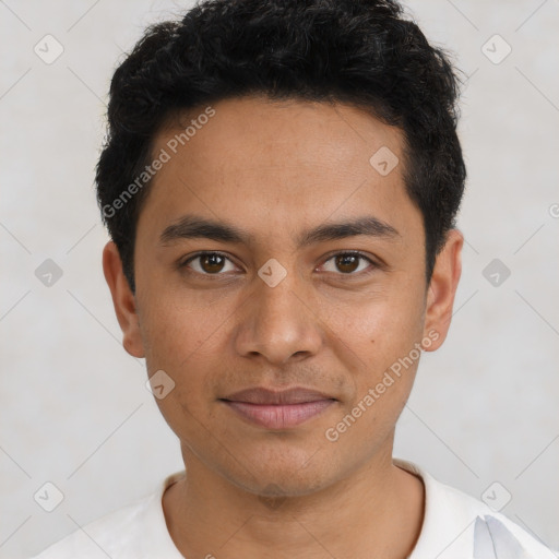 Joyful latino young-adult male with short  black hair and brown eyes