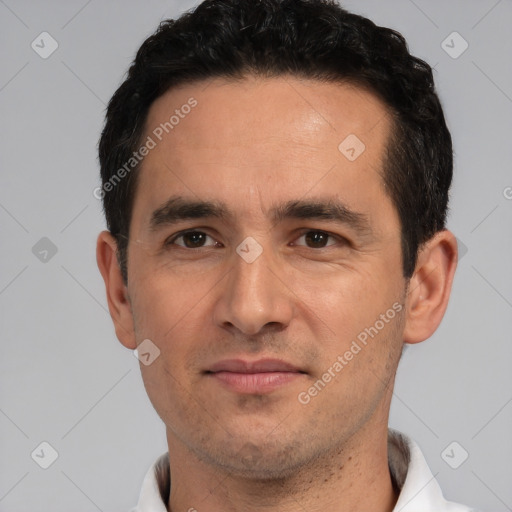 Joyful white young-adult male with short  black hair and brown eyes