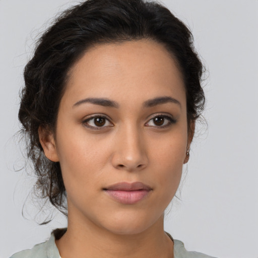 Neutral latino young-adult female with medium  brown hair and brown eyes