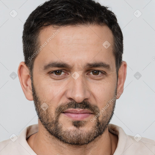 Joyful white adult male with short  brown hair and brown eyes