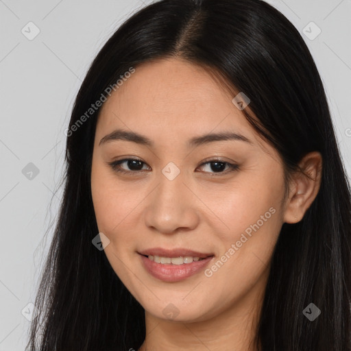 Joyful asian young-adult female with long  brown hair and brown eyes