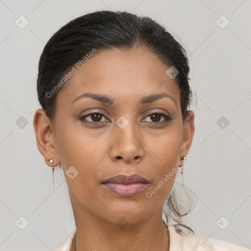 Joyful latino young-adult female with long  brown hair and brown eyes