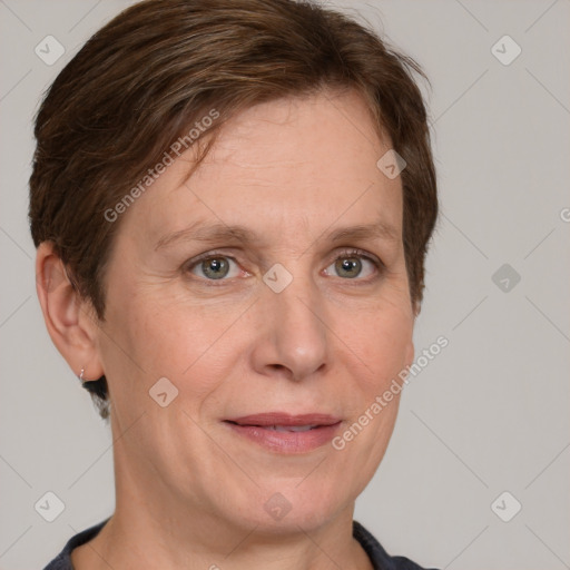 Joyful white adult female with short  brown hair and grey eyes