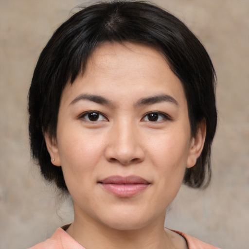 Joyful asian young-adult female with medium  brown hair and brown eyes
