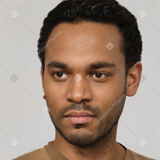 Neutral black young-adult male with short  black hair and brown eyes