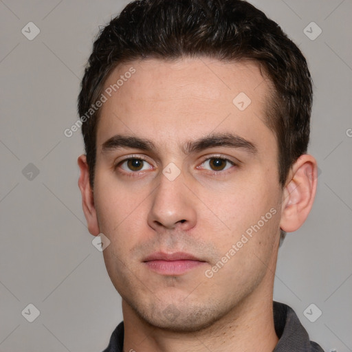 Neutral white young-adult male with short  brown hair and grey eyes