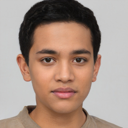 Joyful latino young-adult male with short  brown hair and brown eyes