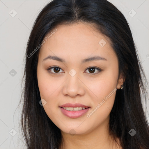 Joyful asian young-adult female with long  brown hair and brown eyes