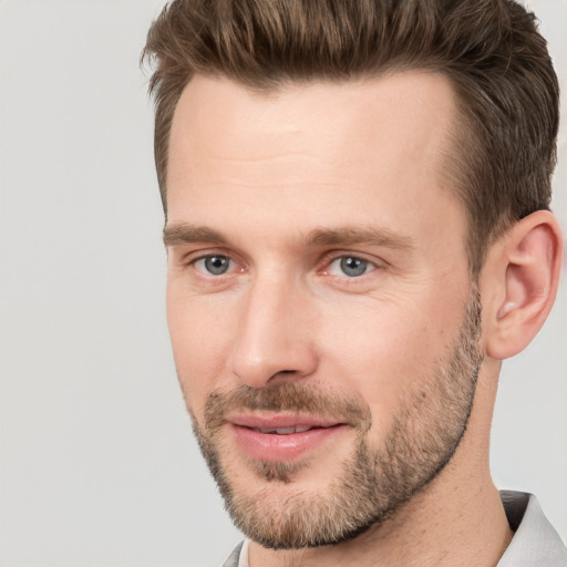 Joyful white young-adult male with short  brown hair and brown eyes