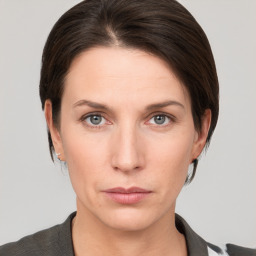 Neutral white young-adult female with short  brown hair and brown eyes