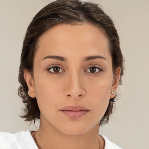 Neutral white young-adult female with medium  brown hair and brown eyes