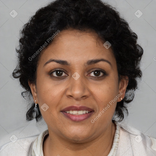 Joyful latino adult female with short  brown hair and brown eyes