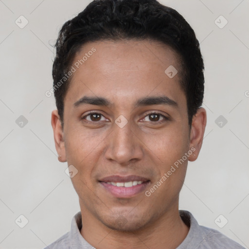 Joyful white young-adult male with short  black hair and brown eyes