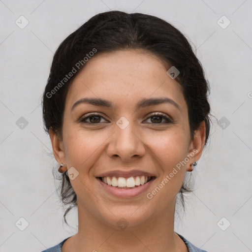 Joyful latino young-adult female with short  brown hair and brown eyes