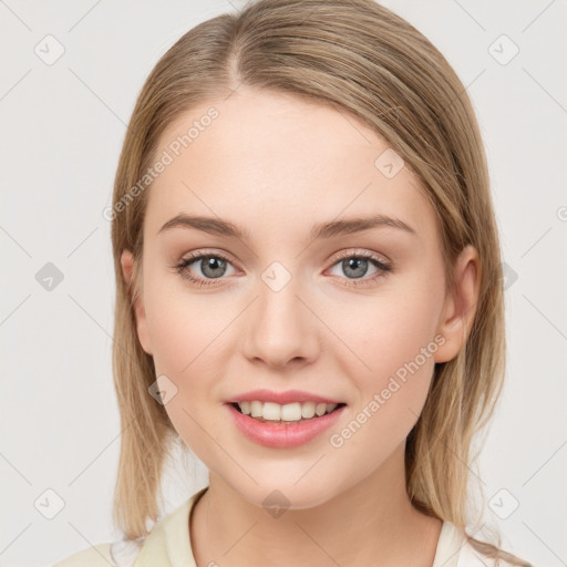 Joyful white young-adult female with medium  brown hair and green eyes