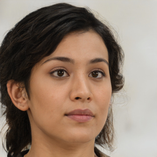 Neutral latino young-adult female with medium  brown hair and brown eyes