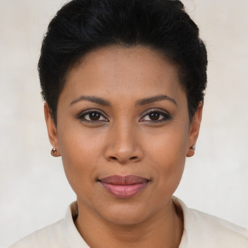 Joyful latino young-adult female with short  brown hair and brown eyes