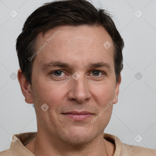 Joyful white adult male with short  brown hair and grey eyes