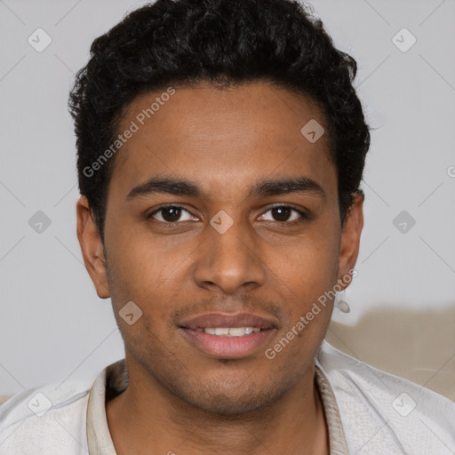 Joyful black young-adult male with short  brown hair and brown eyes